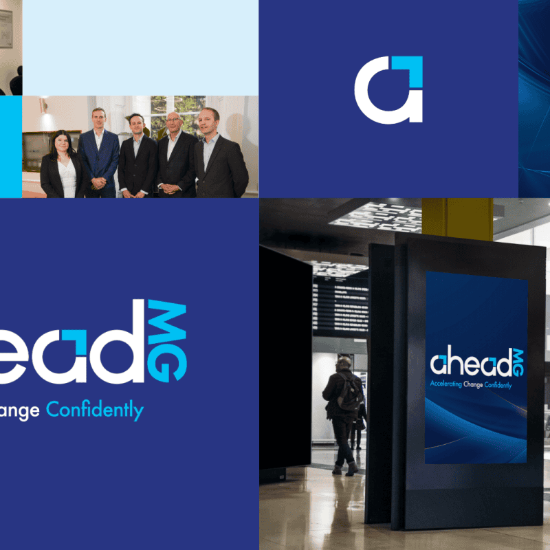 Innovative AheadMG digital signage displays at an airport, showcasing branding with vibrant blue graphics and the company's logo for enhanced customer engagement and brand visibility.